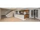Spacious kitchen with a breakfast bar, wooden cabinets, and a tile backsplash, perfect for cooking at 10912 N County Road 950 E, Brownsburg, IN 46112