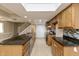 Well-lit kitchen with granite countertops, stainless steel appliances, and ample cabinet space at 10912 N County Road 950 E, Brownsburg, IN 46112
