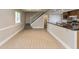 Open-concept living room features a staircase, breakfast bar and easy access to kitchen, great for entertaining at 10912 N County Road 950 E, Brownsburg, IN 46112