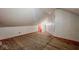 Finished attic with flooring, walls, and an electrical outlet at 1114 N Mount St, Indianapolis, IN 46222