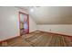 Slanted ceilings and flooring in this attic space at 1114 N Mount St, Indianapolis, IN 46222