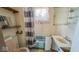 Modest bathroom featuring a shower-tub combo, toilet, and small vanity area at 1114 N Mount St, Indianapolis, IN 46222