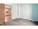 Bedroom featuring pale blue walls and a doorway with a view to another room at 1114 N Mount St, Indianapolis, IN 46222