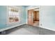 Bright bedroom featuring a window with view of the exterior at 1114 N Mount St, Indianapolis, IN 46222