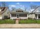 Charming single-story home with a cozy screened-in porch and well-maintained front yard at 1114 N Mount St, Indianapolis, IN 46222