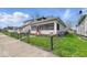 Charming residence with a well-maintained lawn and fence at 1114 N Mount St, Indianapolis, IN 46222