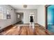 View of the living room featuring hard wood floors and multiple doorways at 1114 N Mount St, Indianapolis, IN 46222