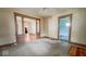 View of the living room featuring detailed trim work around doorways and windows at 1114 N Mount St, Indianapolis, IN 46222