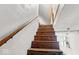 Wooden staircase with handrail at 1114 N Mount St, Indianapolis, IN 46222