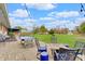 Spacious patio with outdoor seating, pool table, and lush green backyard at 120 Crosby Dr, Indianapolis, IN 46227