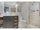Clean bathroom featuring a shower with glass door, modern vanity, and patterned flooring at 120 Crosby Dr, Indianapolis, IN 46227