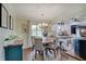 Open concept dining area with wood floors and view of the kitchen at 120 Crosby Dr, Indianapolis, IN 46227