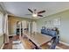 Dining room with wood floors, bench seating, ceiling fan, and natural lighting at 120 Crosby Dr, Indianapolis, IN 46227