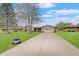 Charming single-story home with a well-manicured lawn, mature trees, and a spacious driveway at 120 Crosby Dr, Indianapolis, IN 46227