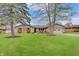 Charming brick ranch home with a well-manicured lawn and attached one car garage at 120 Crosby Dr, Indianapolis, IN 46227
