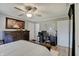 Comfortable main bedroom with a ceiling fan, large bed, and a black desk at 120 Crosby Dr, Indianapolis, IN 46227