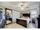 Comfortable main bedroom with a ceiling fan, large bed, and a large mirror at 120 Crosby Dr, Indianapolis, IN 46227