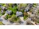 Aerial view of neighborhood featuring the home, mature trees, and green landscaping at 12011 Glen Cove Dr, Indianapolis, IN 46236