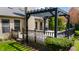 Spacious deck with black pergola and string lights, overlooking landscaped yard at 12011 Glen Cove Dr, Indianapolis, IN 46236