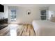 Bright bedroom with two large windows and hardwood floors creates a peaceful retreat at 12011 Glen Cove Dr, Indianapolis, IN 46236