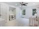 Bright Bedroom with neutral tones, a ceiling fan, and two windows at 12011 Glen Cove Dr, Indianapolis, IN 46236
