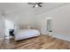 Relaxing bedroom with a vaulted ceiling and hardwood floors leads to the modern bathroom at 12011 Glen Cove Dr, Indianapolis, IN 46236