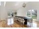 Bright dining room with vaulted ceilings, hardwood floors, and large windows at 12011 Glen Cove Dr, Indianapolis, IN 46236