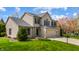 Charming two-story home featuring a two-car garage and mature trees at 12011 Glen Cove Dr, Indianapolis, IN 46236