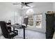 Bright home office with large window and modern desk setup at 12011 Glen Cove Dr, Indianapolis, IN 46236