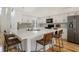 Eat-in kitchen featuring a large countertop island and stainless steel appliances at 12011 Glen Cove Dr, Indianapolis, IN 46236