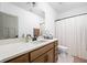 This primary bathroom has a white counter, vanity and light brown cabinets at 1230 Amberley Way, Westfield, IN 46074