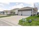 Home with a two-car garage and concrete driveway surrounded by green grass at 1230 Amberley Way, Westfield, IN 46074