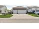 Home with a two-car garage and concrete driveway surrounded by green grass at 1230 Amberley Way, Westfield, IN 46074