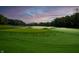 Scenic view of a lush green golf course under a beautiful sunrise sky at 1230 Amberley Way, Westfield, IN 46074