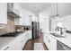 Well-equipped kitchen with stainless steel appliances, sleek countertops, and ample storage at 1230 Amberley Way, Westfield, IN 46074