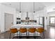 Modern kitchen featuring a large island, stainless steel appliances, and stylish pendant lighting at 1230 Amberley Way, Westfield, IN 46074