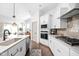 Well-equipped kitchen featuring stainless steel appliances, sleek countertops, and island sink at 1230 Amberley Way, Westfield, IN 46074