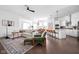 Open-concept living space with modern kitchen, dining area, and comfortable seating at 1230 Amberley Way, Westfield, IN 46074