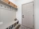 Mudroom with built-in storage, hooks, and bench for organized entry at 1230 Amberley Way, Westfield, IN 46074