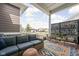 Inviting outdoor patio with comfortable seating and view of the neighborhood at 1230 Amberley Way, Westfield, IN 46074