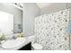 Cozy bathroom featuring a stylish vanity, floral shower curtain, and neutral gray wall paint at 1239 Northcraft Ct, Franklin, IN 46131