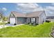 Well-maintained home exterior with a two-car garage, neat lawn, and attractive landscaping at 1239 Northcraft Ct, Franklin, IN 46131