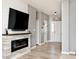 Living room view showcases a stone fireplace and a glimpse of the home's bright, naturally lit foyer at 1239 Northcraft Ct, Franklin, IN 46131