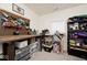 Versatile office area with a custom wooden desk, pegboard wall organizer, and ample storage options at 1239 Northcraft Ct, Franklin, IN 46131