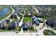 Aerial view of a neighborhood featuring large homes, lush landscaping, winding roads, and serene ponds at 12725 Parsons Gate, Carmel, IN 46032