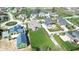 Beautiful aerial view of a neighborhood featuring mature trees, large lawns, a pond, and stately homes at 12725 Parsons Gate, Carmel, IN 46032