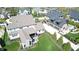 Aerial view showcases backyard patio with seating area, lush green lawn, and well-maintained landscaping at 12725 Parsons Gate, Carmel, IN 46032