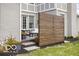A backyard patio with a modern privacy screen, seating and flowers at 12725 Parsons Gate, Carmel, IN 46032