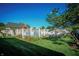 Backyard featuring a gated pool, surrounded by green lawn and partial view of a charming home at 12725 Parsons Gate, Carmel, IN 46032