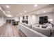 Finished basement with a bar, dining area, and entertainment setup, offering ample space for recreation and relaxation at 12725 Parsons Gate, Carmel, IN 46032